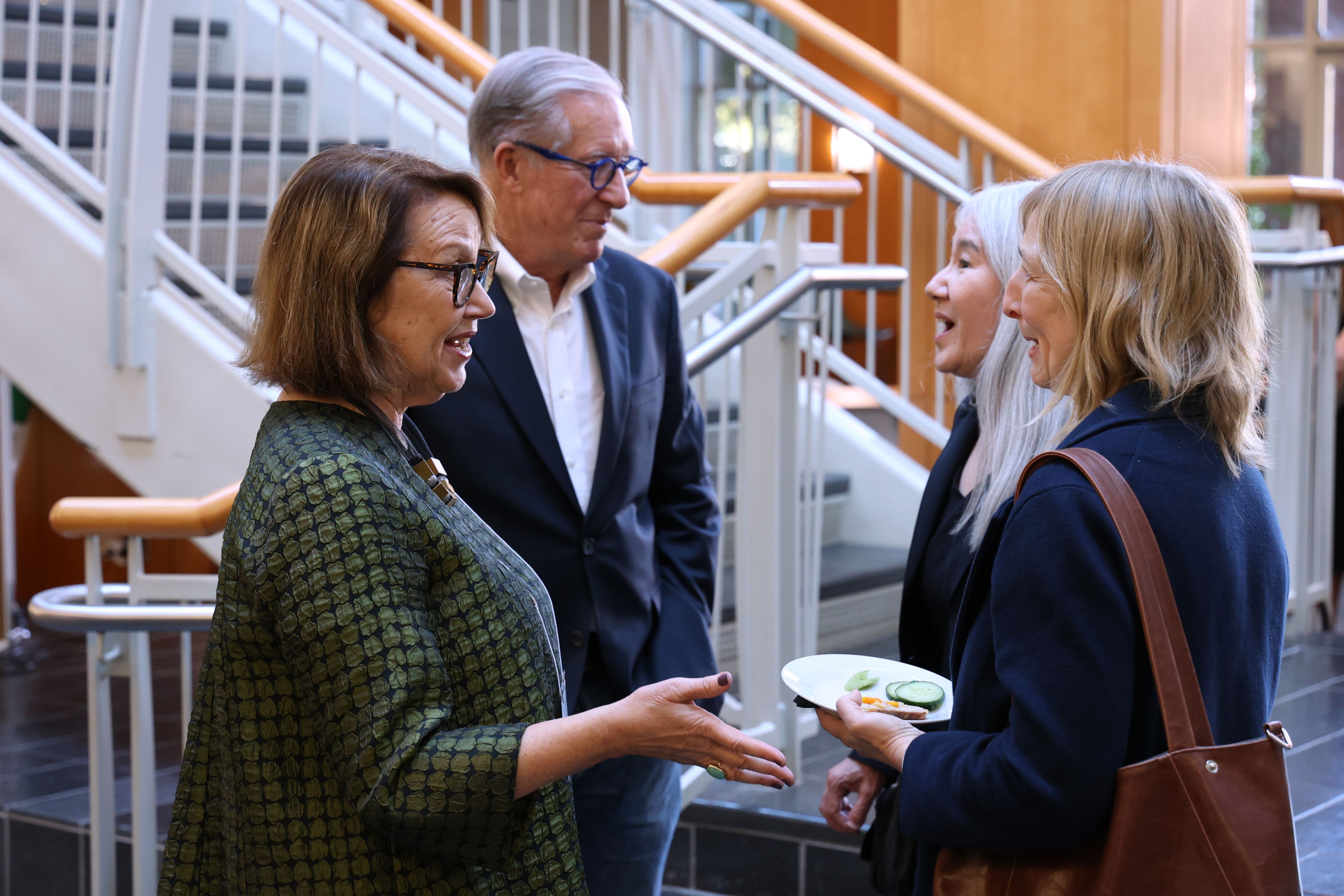 group of people throw the 'o'