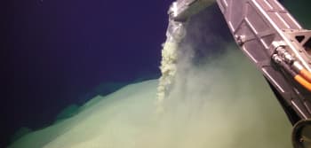 A machine vacuuming up ash from the seafloor