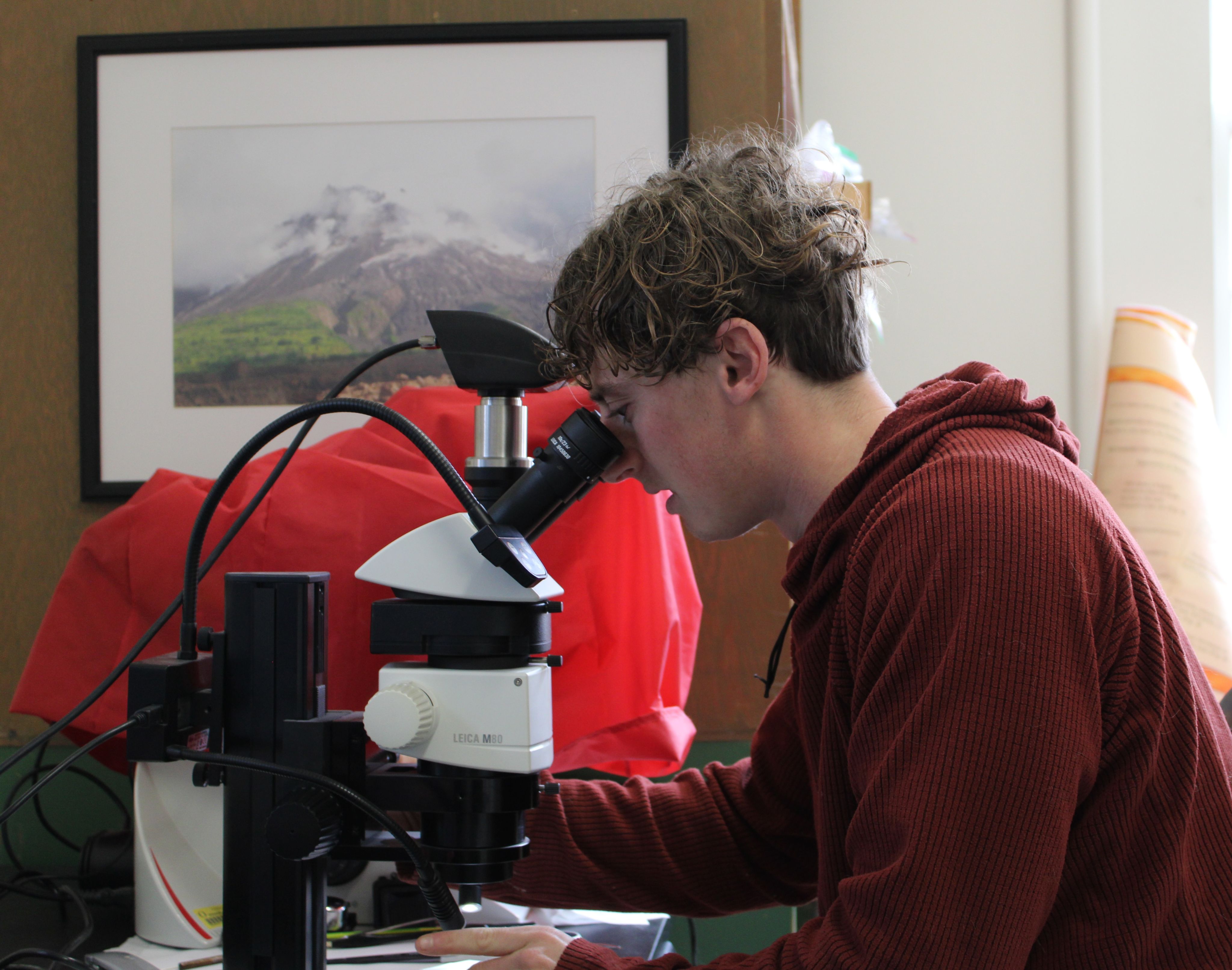 Man looking through a microscope