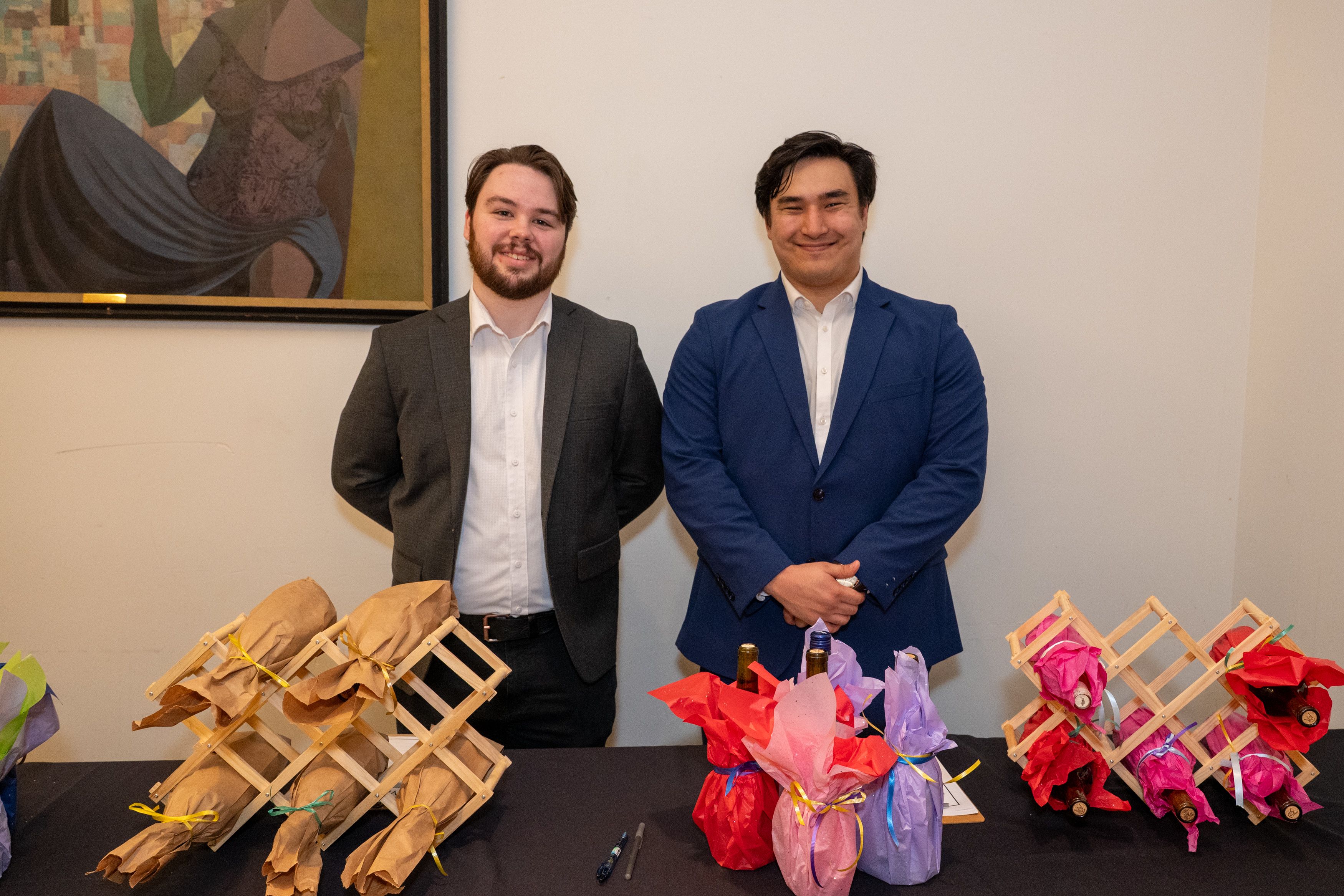 Student staff the wine wall. 