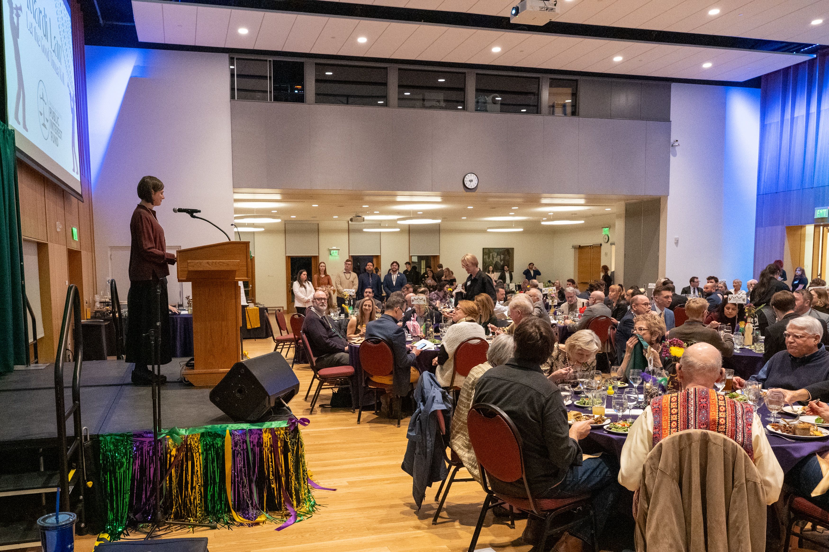 Dean Jen Reynolds speaks to a full room of guests.