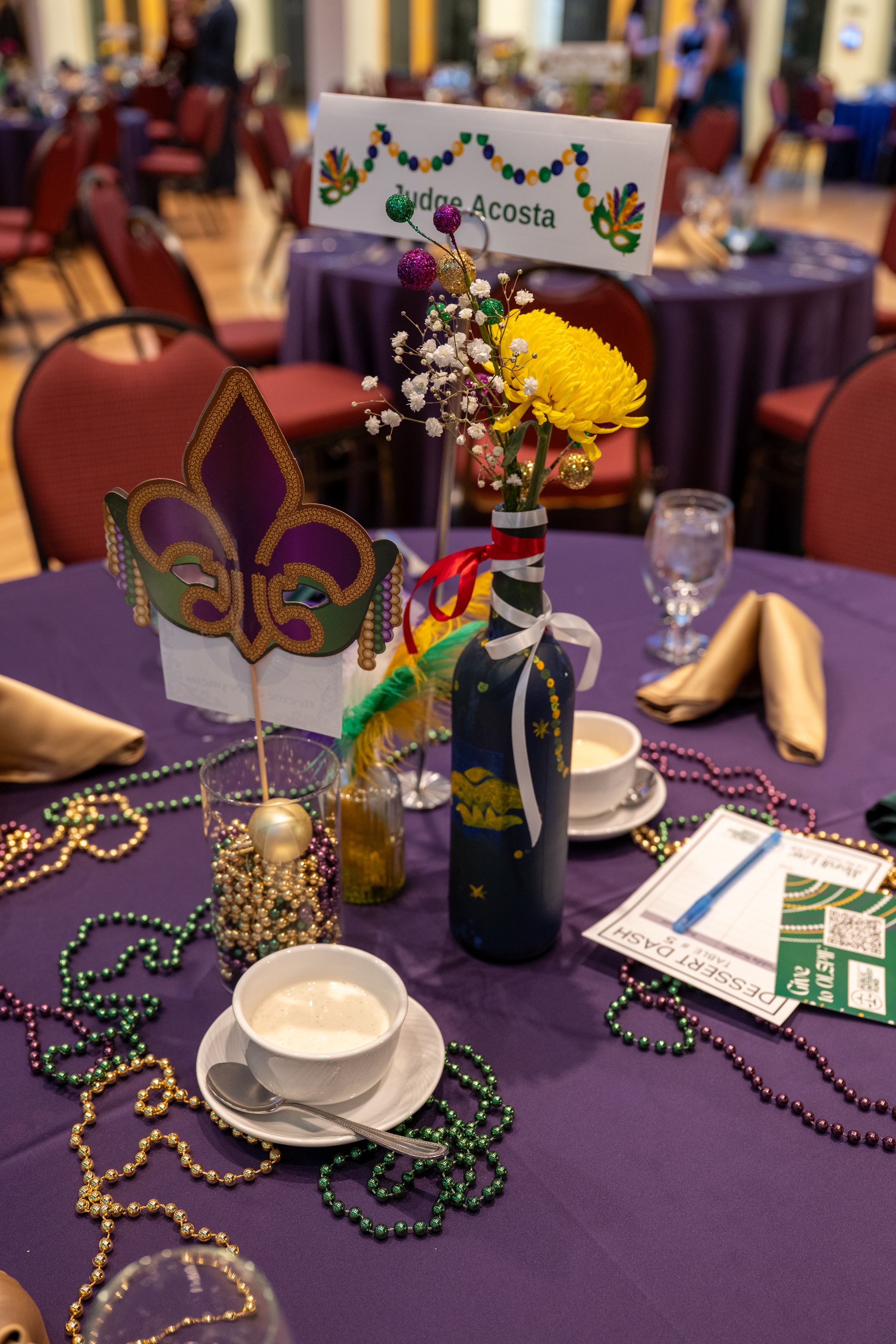 Judge Acosta's table with flowers and mardi gras beads.