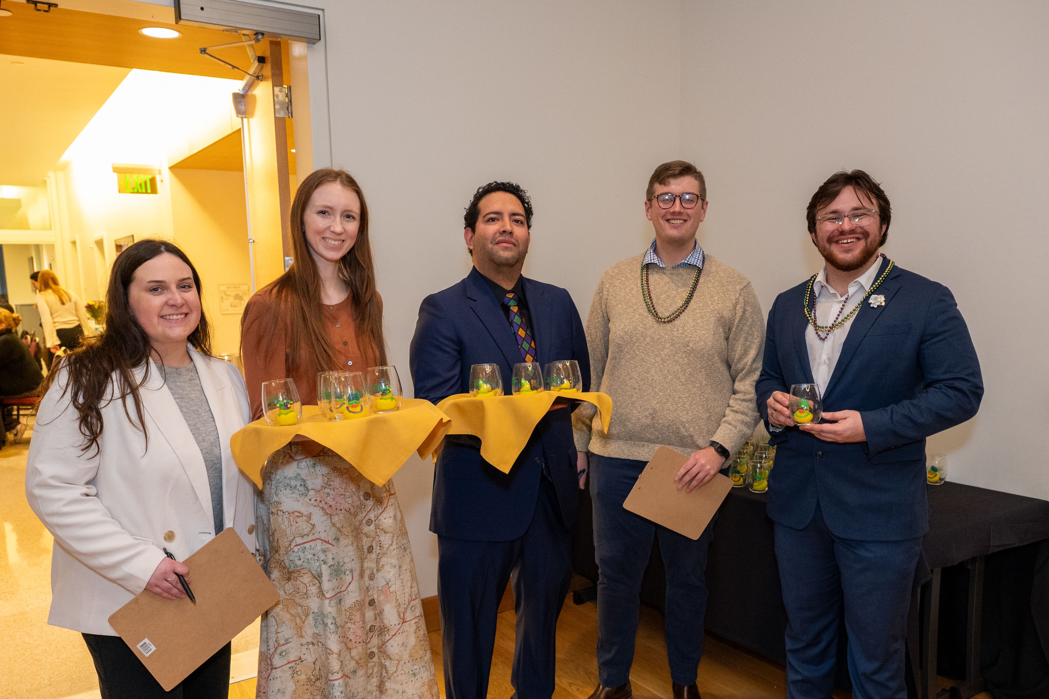 Group of five law students with trays of OLPSPIF raffle ducks. 