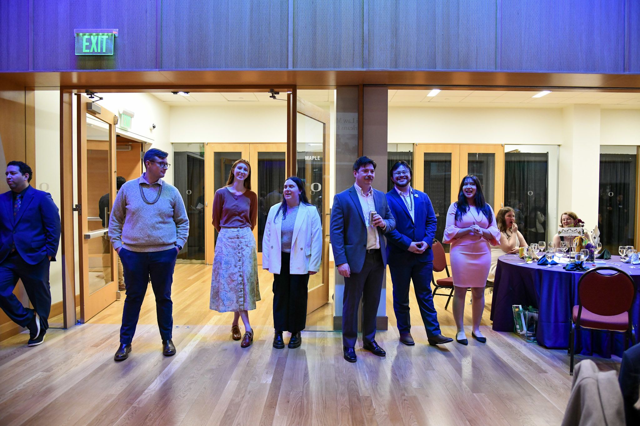 Students standing during the paddle raise.