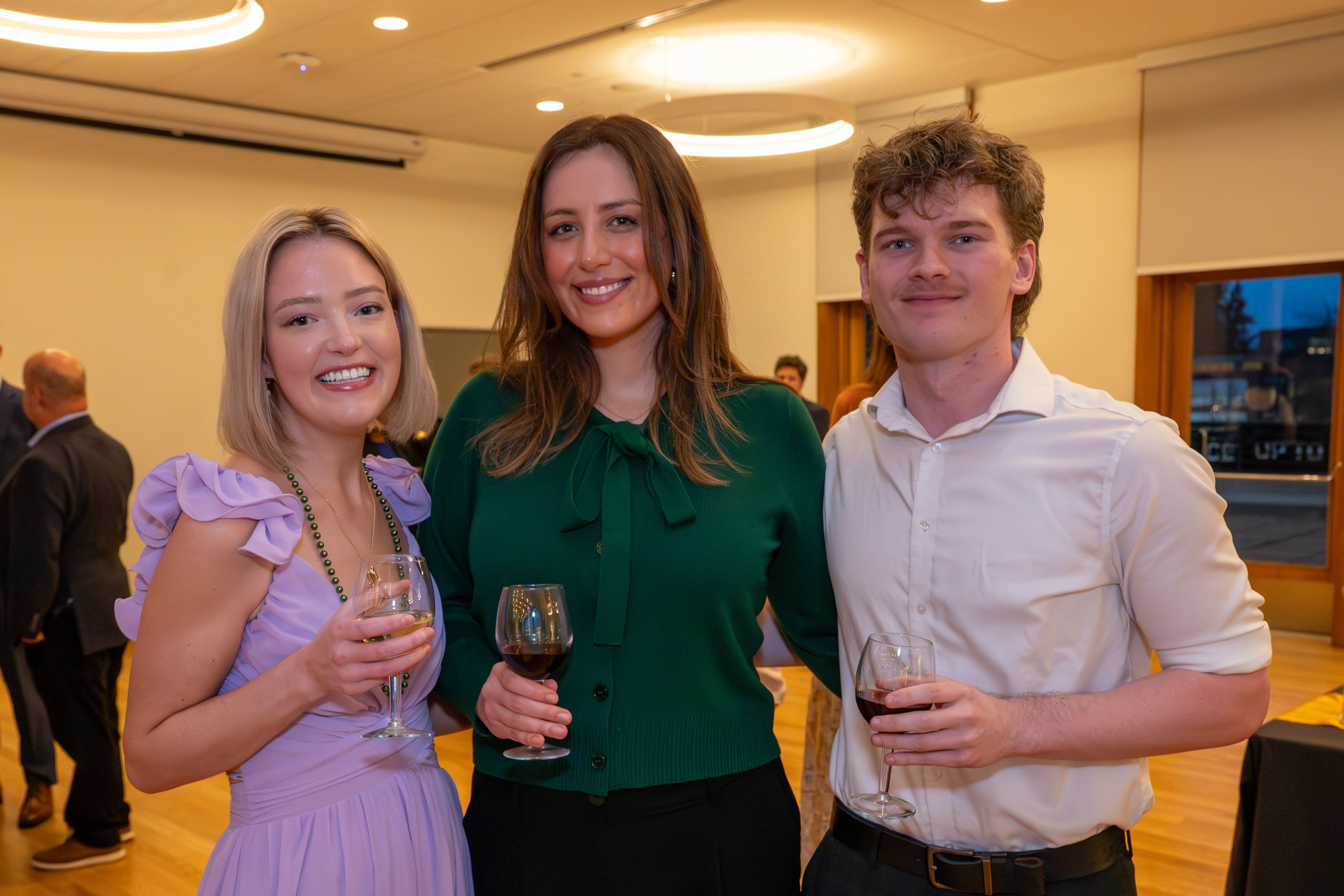 Guests drinking wine during the reception.
