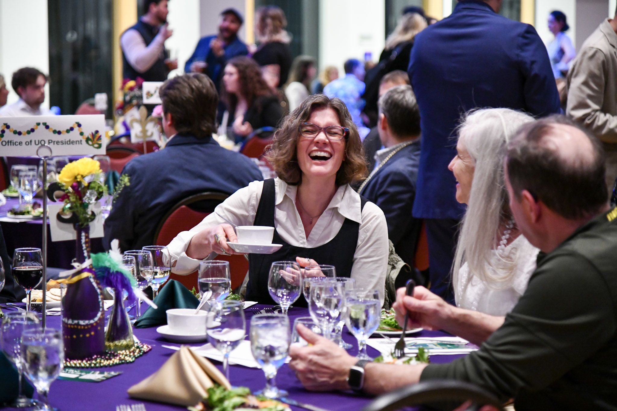 Guest laughing at their table.  