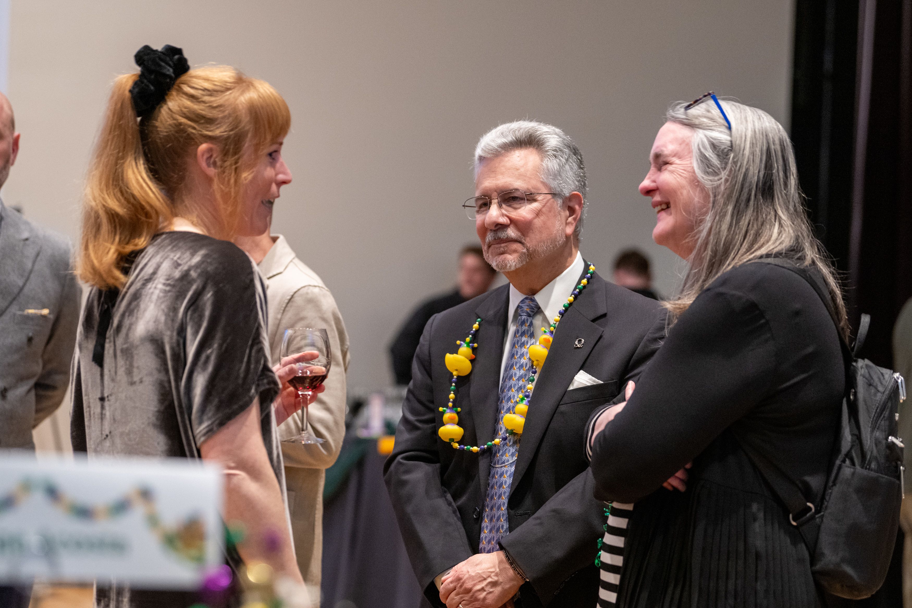 Judge John Acosta and wife Lenice Shaw talking to a guest.